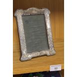 A HALLMARKED SILVER PICTURE FRAME