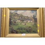 A GILT FRAMED ANTIQUE OIL ON CANVAS OF A COTTAGE