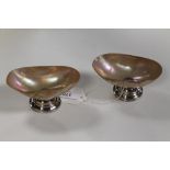 A PAIR OF HALLMARKED SILVER OVAL MOTHER OF PEARL DISHES