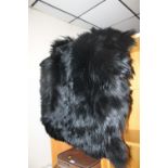 TWO BLACK FUR RUGS