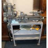 A 'MYFORD ML7' METAL WORKING LATHE, on fitted stand. In good condition but not tested. Together wit