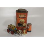 A VINTAGE TIN PLATE WIND - UP STAGE COACH TOY, together with two money boxes and a vintage 'Hacks'