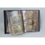 AN ALBUM OF WORLD BANKNOTES, to include an India 1917 Rupee, various French pre-war issues and two