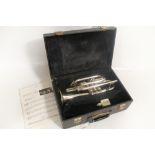 AN EARLY 20TH CENTURY SILVER PLATED CORNET IN HARD CARRY CASE