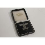 A 1939 CASED BAR TO THE IRON CROSS 2ND CLASS. Pin back type, marked L/56 to back
