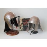 FOUR REPRODUCTION ARMOUR HELMETS, to include two Cromwellian lobster tail types, a medieval crusade