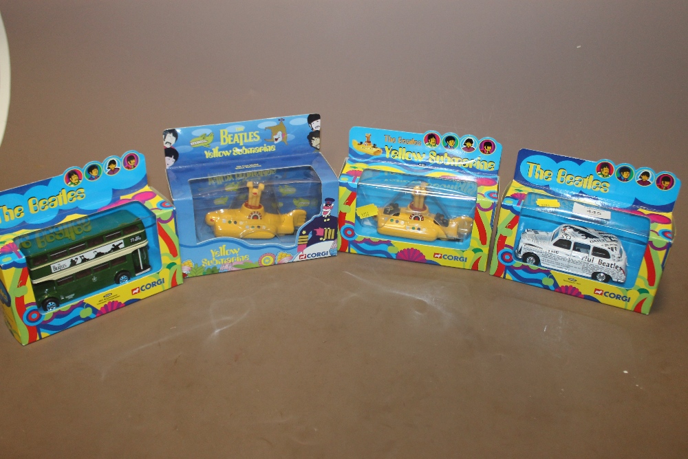FOUR BOXED CORGI THE BEATLES THEMED TOY VEHICLES TO INCLUDE TWO YELLOW SUBMARINE EXAMPLES