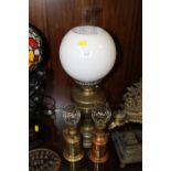 A VINTAGE OIL LAMP AND SHADE PLUS TWO OTHERS