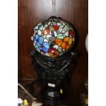 A LARGE FIGURATIVE TIFFANY STYLE TABLE LAMP