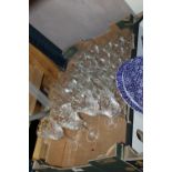 A TRAY OF DRINKING GLASSES TO INCLUDE FLORALLY ETCHED EXAMPLES