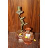 A BRASS CANDLESTICK ON ONYX BASE IN THE SHAPE OF HERMES PLUS A SMALL VASE
