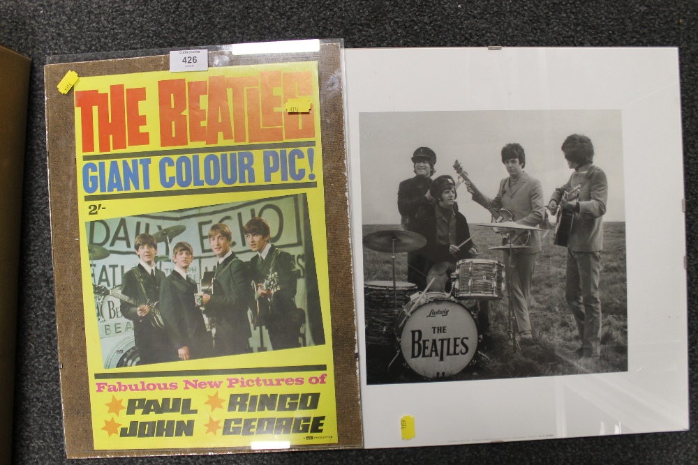 A BEATLES PYX PRODUCTION POSTER IN CLIP FRAME AND A BEATLES ON SALISBURY PLAIN BLACK AND WHITE