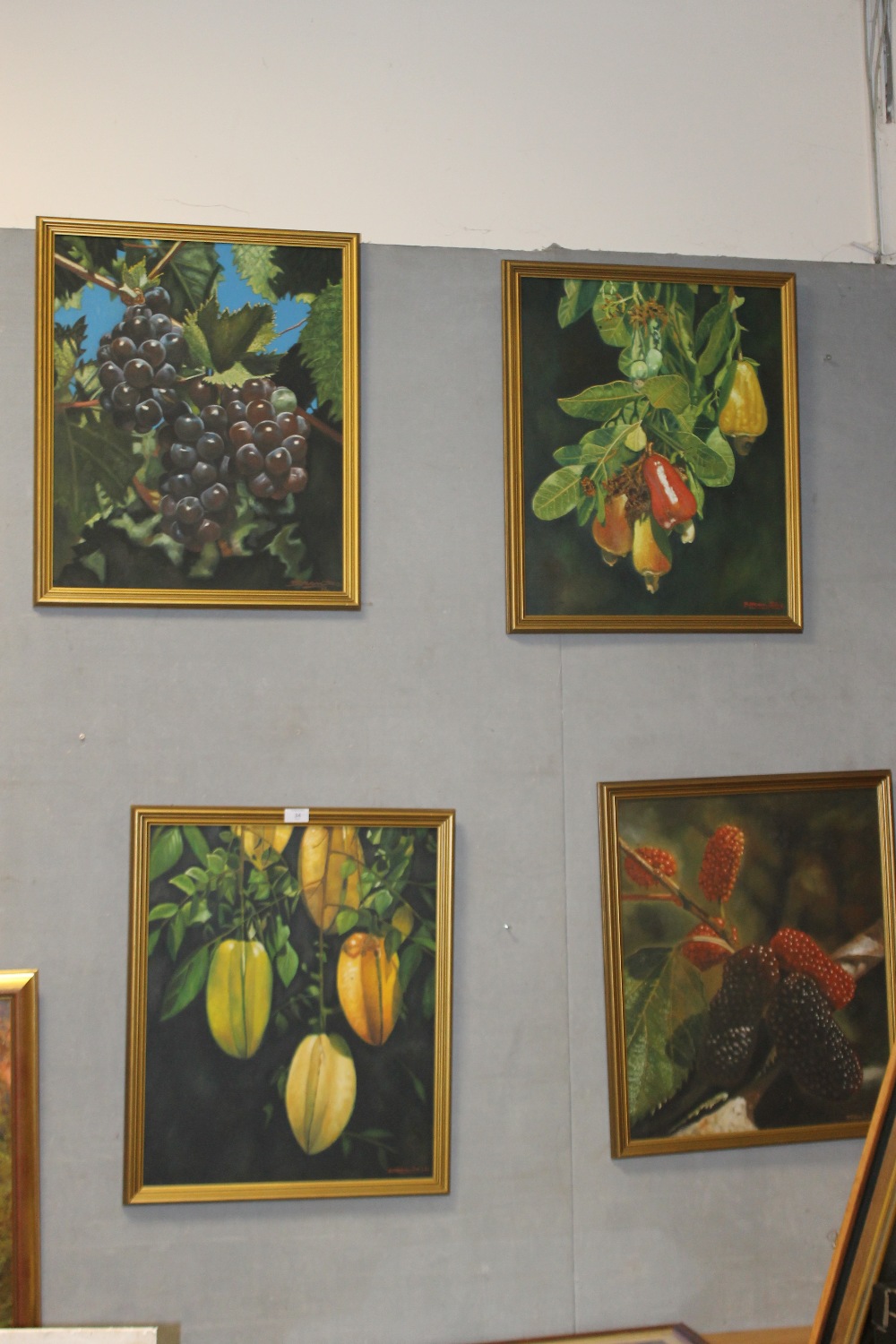 A SET OF FOUR GILT FRAMED OIL ON CANVAS STILL LIFE PAINTINGS DEPICTING FRUITS