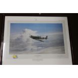 A FRAMED AND GLAZED ROBERT TAYLOR PRINT TITLED 'REACH FOR THE SKIES'