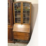 A LEADED OAK BUREAU BOOKCASE