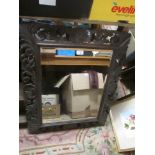 A VINTAGE JACOBEAN STYLE CARVED OAK WALL MIRROR