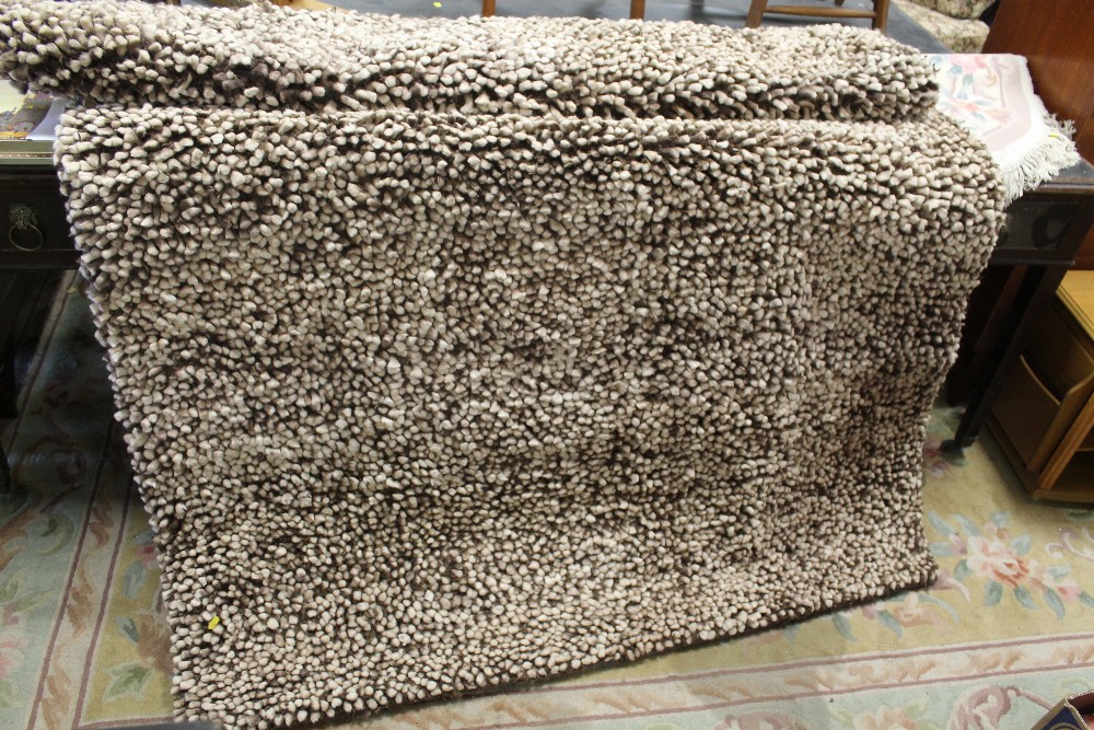 A MODERN BROWN WOOLLEN RUG