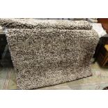 A MODERN BROWN WOOLLEN RUG