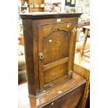 A 19TH CENTURY SMALL OAK HANGING CORNER CUPBOARD