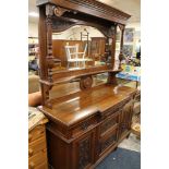 A LARGE VICTORIAN OAK CARVED MIRRORBACKED SIDEBOARD