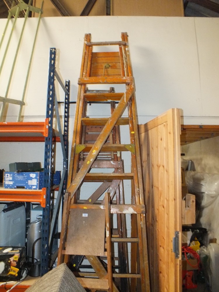 FOUR WOODEN SETS OF STEP LADDERS OF VARIOUS SIZES