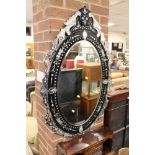 A MODERN VENETIAN STYLE WALL MIRROR