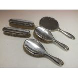 A HALLMARKED SILVER FIVE PIECE DRESSING TABLE SET