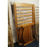 A HONEY PINE SINGLE BED FRAME WITH MATTRESS