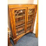 A MAHOGANY GLAZED TWO DOOR BOOKCASE