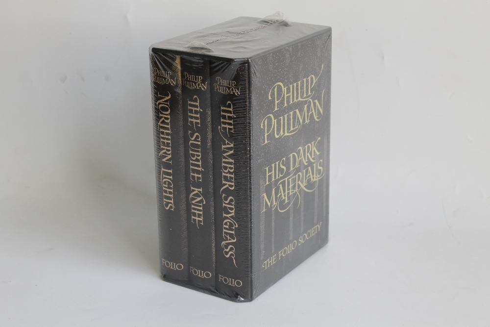 PHILLIP PULLMAN - 'HIS DARK MATERIALS' FOLIO SOCIETY, three volume set of books in slipcase and sea