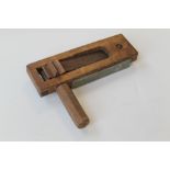 A WWII WOODEN AIR RAID RATTLE MK IV, stamped and dated 1942