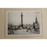 A FRAMED AND GLAZED ENGRAVING OF TRAFALGAR SQUARE BY W MONK