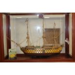 A LARGE KIT BUILT MODEL OF 'HMS VICTORY', contained in a large glazed display cabinet, also togethe