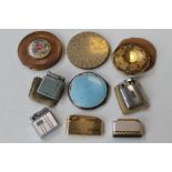 A SILVER AND ENAMEL POWDER COMPACT A/F, along with three powder compacts and a quantity of lighter