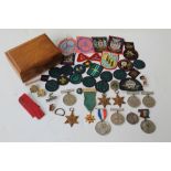 SEVEN WWII SERVICE MEDALS (un-named as issued) and a quantity of minor badges and medallions