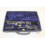 A CASED ANTIQUE 'HOWARTH & CO LONDON' OBOE. Hardwood with silver plated fittings.