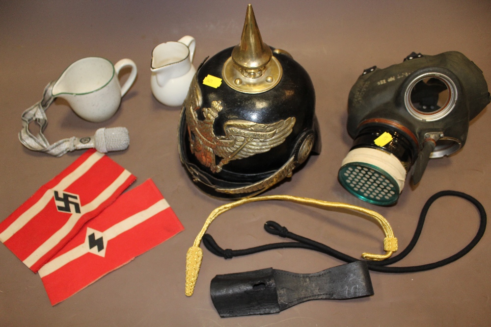 A BOX OF MILITARIA TO INCLUDE WWII GAS MASK, REPRO GERMAN HELMET, ETC