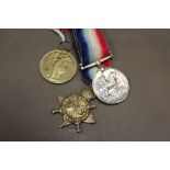 A SET OF THREE FIRST WORLD WAR MEDALS PRESENTED TO 68047 GNR W GORST OF THE RFA