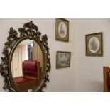 A MODERN OVAL MIRROR WITH FLORENTINE STYLE TOGETHER WITH A SELECTION OF PRINTS AND A LAMP