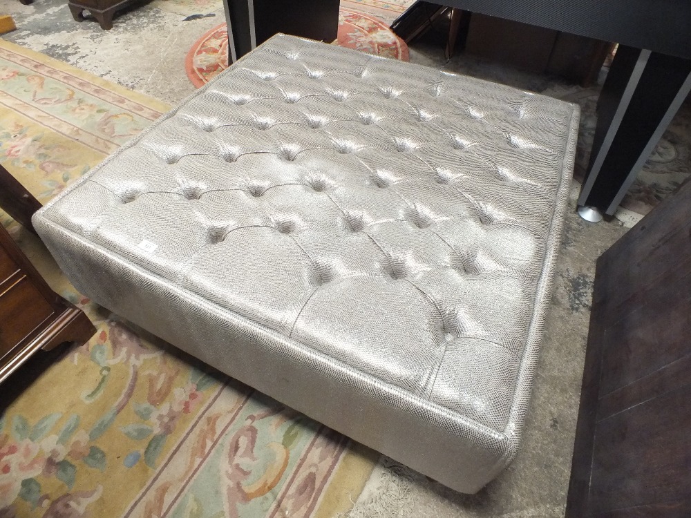 A LARGE MODERN SILVER FOOTSTOOL