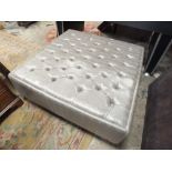 A LARGE MODERN SILVER FOOTSTOOL