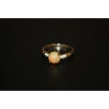 A BOXED LADIES 9CT GOLD RING SET WITH A FIRE OPAL STYLE STONE