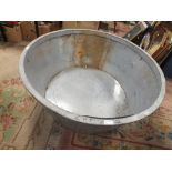 A LARGE GALVANIZED CIRCULAR TUB