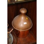 A LARGE COPPER BOTTLE WITH CORK STOPPER