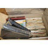 A BOX OF VINTAGE BOOKS AND 7" SINGLE RECORDS TO INCLUDE AC DC, THE BEATLES ETC