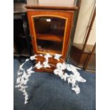 A CHERRYWOOD MUSIC CABINET WITH A WALL HANGING