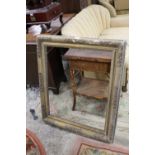 A LARGE VINTAGE GILT PICTURE FRAME