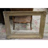 A LARGE VINTAGE GILT PICTURE FRAME