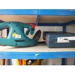 A BOSCH ELECTRIC HEDGE TRIMMER AND CASE OF BITS