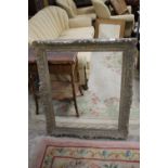 A LARGE ANTIQUE GILT PICTURE FRAME